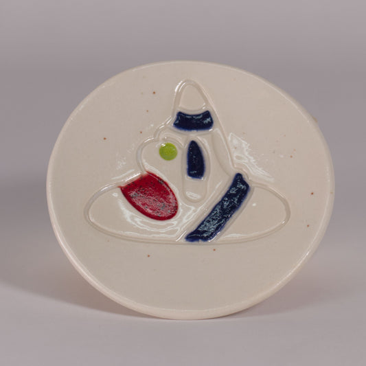 porcelain plate with taino cemi image made by Nana Abreu