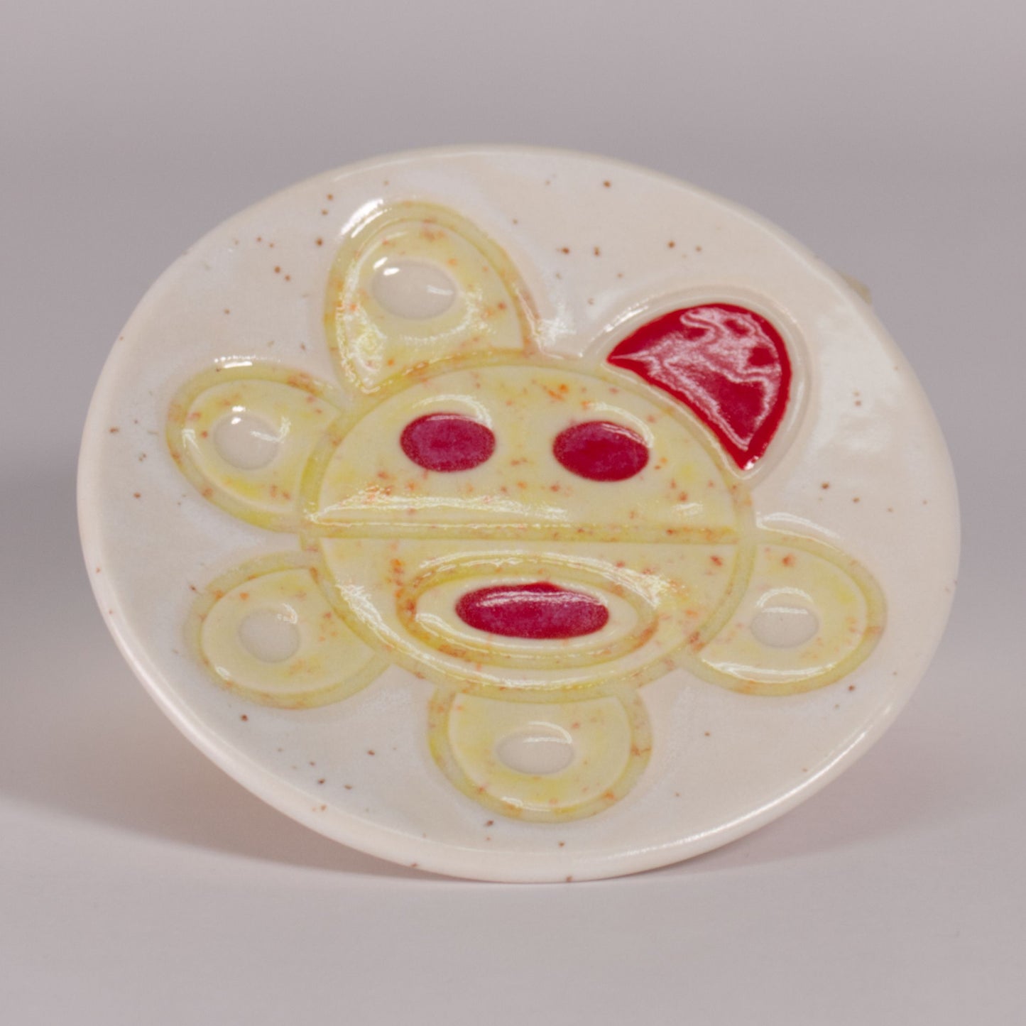 porcelain plate w taino sun by Nana Abreu