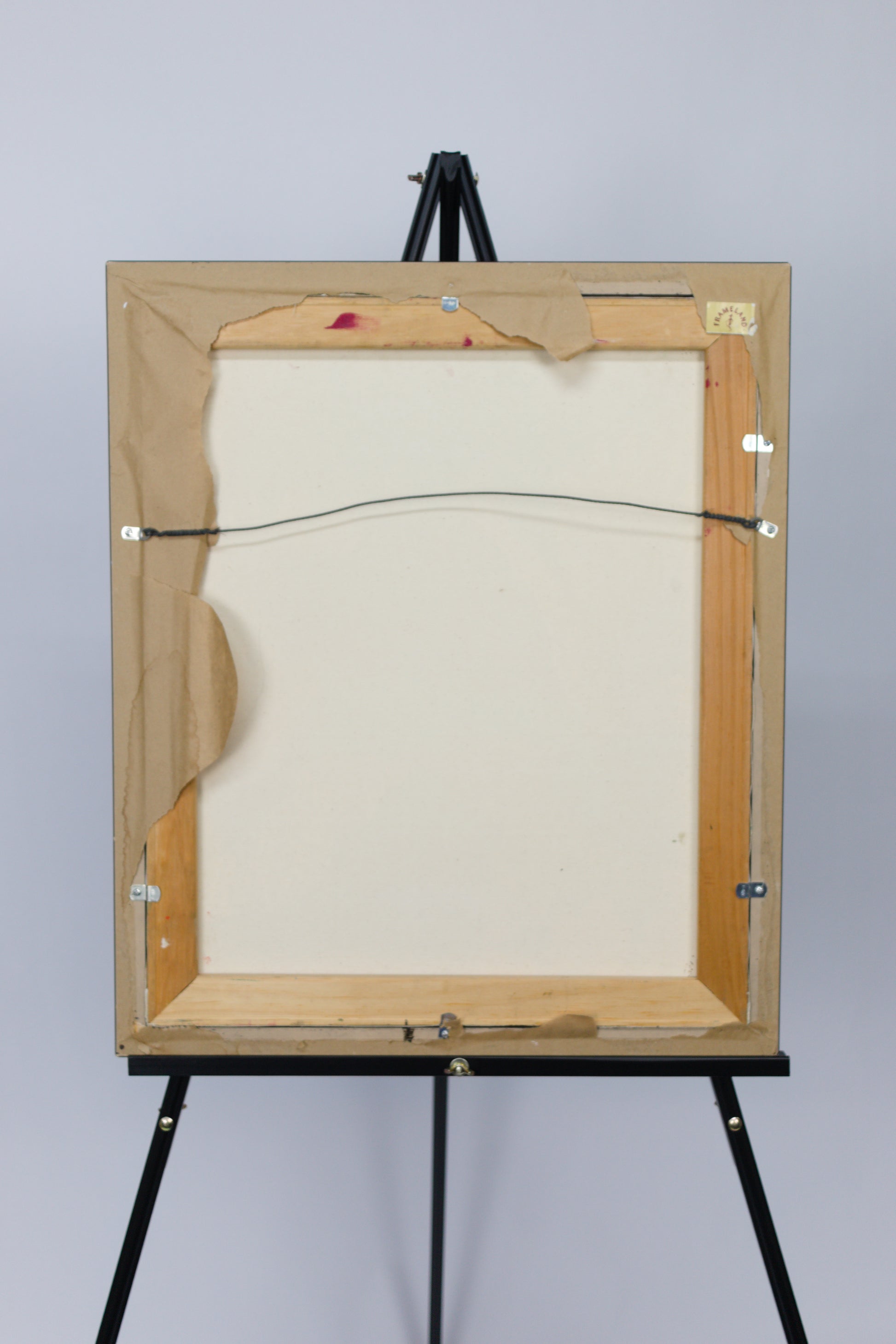 back of framed painting